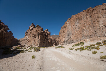 Fototapeta na wymiar deserted dirt road with mountains as beautiful wallpaper, landscape with sunlight, natural ecosystem