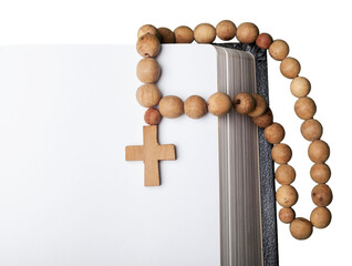 Opened old bible and wooden cross