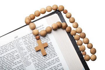 Opened old thick bible with wooden cross