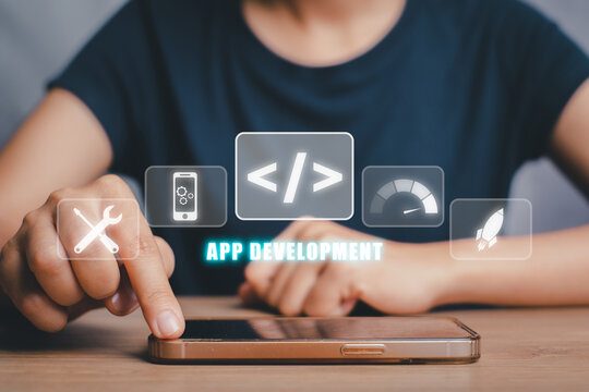 App development concept, Person hand using smart phone with app development icon on virtual screen background, Designing application for mobile phone.