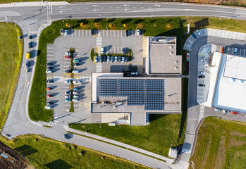Array of solar panels on the roof of a commercial building top down