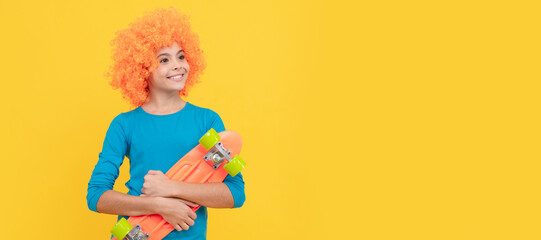 skateboarding. cheerful child holding penny board. teen girl with fancy hairstyle. being a clown. Funny teenager child on party, poster banner header with copy space.