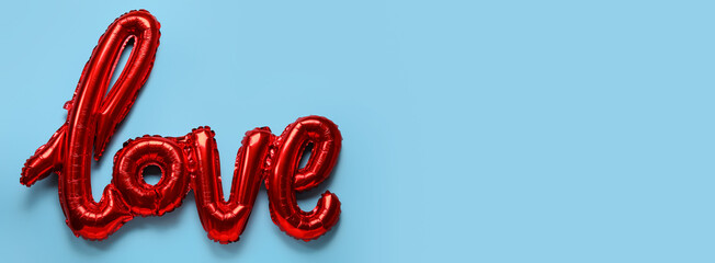Fototapeta premium Balloon in shape of word LOVE on light blue background with space for text. Valentine's Day celebration