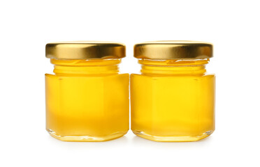 Jars with fresh honey isolated on white background
