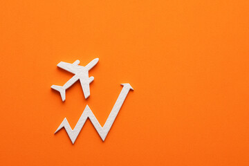 Increase in air tickets - Small white plane on orange background