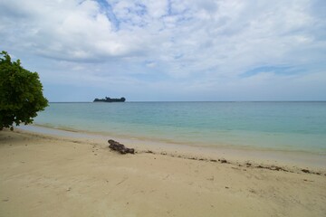 Tropical Beach, Wave and Blue Sea Water. This photo was taken on one of the tropical islands in Kotabaru, Indonesia.