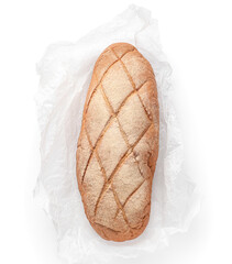 Baking paper with loaf of fresh bread on white background