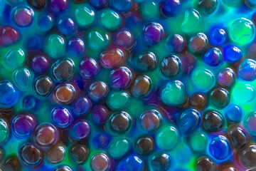 Blue green orbiz balls in water.Hydrogel balls for decoration, gardening and air...