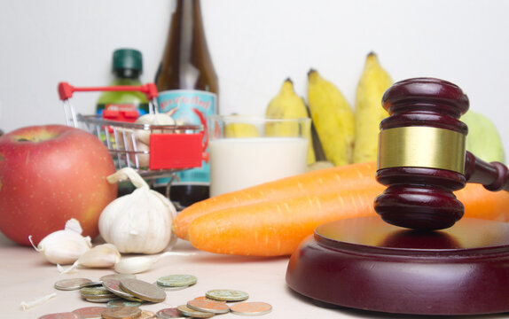 Consumer protection concept.Justice hammer with food background.