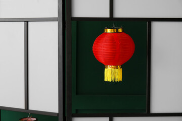 Folding screen with lantern for Chinese New Year celebration in room, closeup