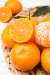 Fresh juicy tangerines on white wooden table, closeup