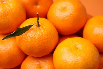 Heap of fresh juicy tangerines as background, closeup