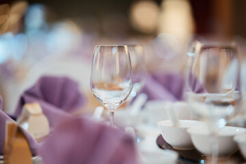 Wedding table decoration. Wine glass on table top. Table setting for wedding guest.