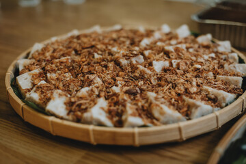Traditional nyonya kuih on rattan basket tray. Cultural food. Traditional Chinese dessert.