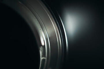 Camera lens with lens reflections and black background. Close up of lens image.