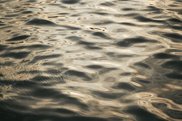 Sunlight hitting on seawater textured background. Abstract sea water pattern.