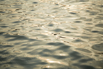 Sunlight hitting on seawater textured background. Abstract sea water pattern.
