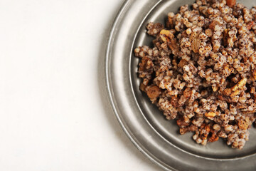 Plate of Kutya on white background, closeup