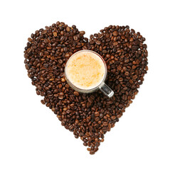 Heart made of coffee beans and coffee cup on white background. Valentine's Day celebration