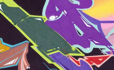 Colorful background of graffiti painting artwork with bright aerosol strips on metal wall. Old...