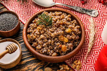 Bowl of Kutya with Christmas branch on napkin, closeup