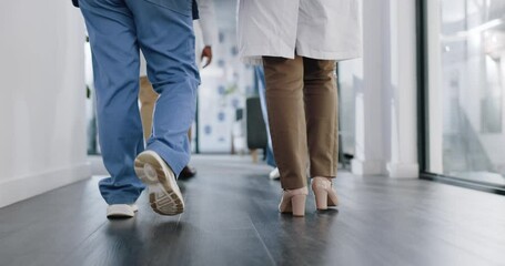 Legs, team and doctors walking in hospital with health, medicine and medical collaboration with cardiovascular healthcare. Surgeon, cardiology and medic community, teamwork at cardio clinic. - Powered by Adobe