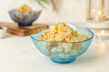 Bowl of rice Kutya on white table, closeup