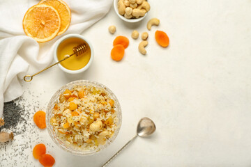 Glass bowl of rice Kutya and ingredients on white background