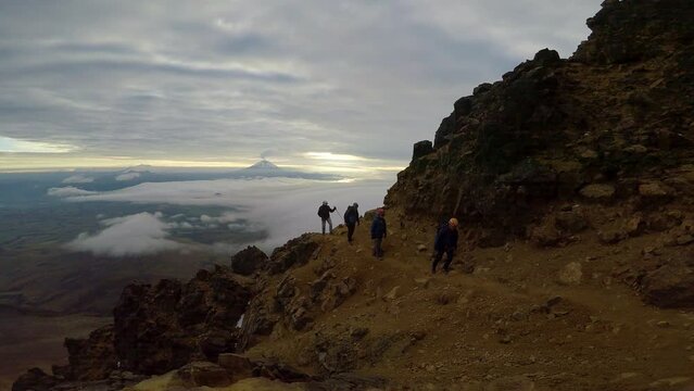 mountaineer in the north ilinzia volcano at sunrise 