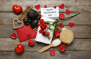 Beautiful composition for Valentine's Day with spa supplies on wooden background