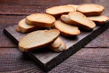 Tasty hard chuck crackers on wooden table