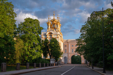 View of the Church of the Ascension of Christ-the palace church of the Catherine Palace and the arch of the Pushkin Memorial Museum-Lyceum in Tsarskoye Selo on a summer day. Pushkin, St. Petersburg