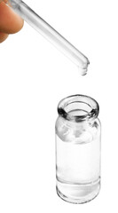 A drop falls from a pipette in cosmetic or medical glass bottle