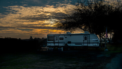 Camping in trailer in winter under a beautiful sky