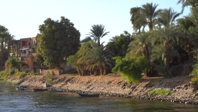 Small Village Along Nile River at Sunset