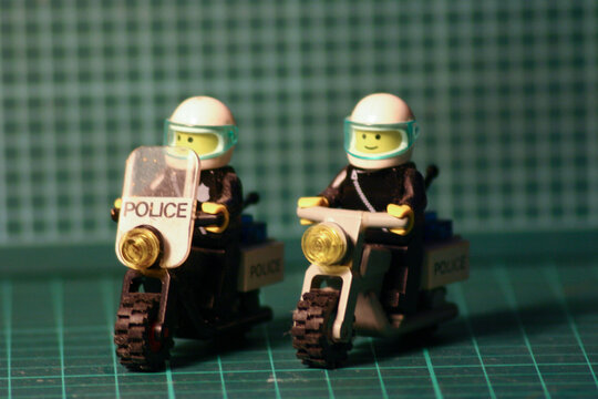the Lego Duplo policeman figure on police motorcycle