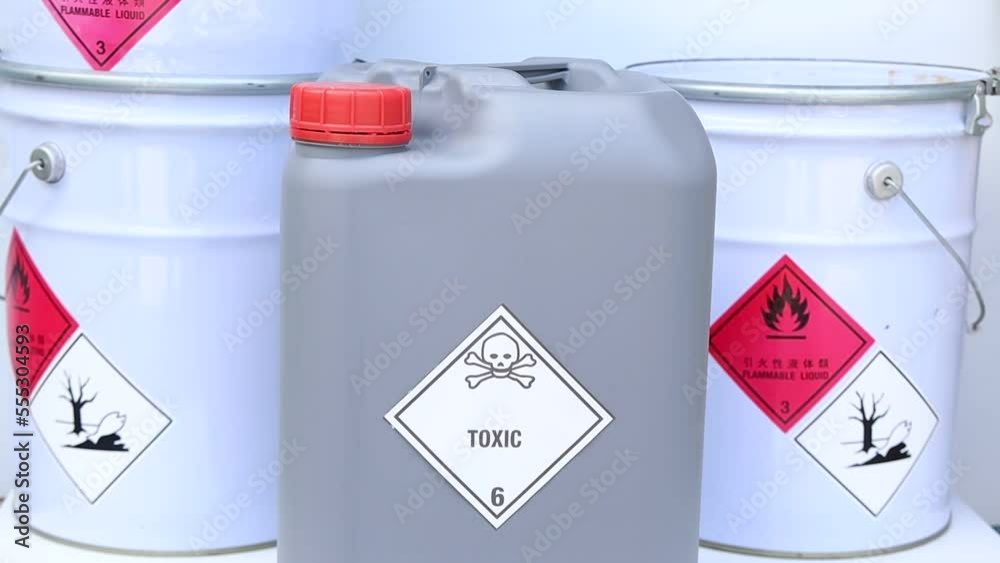 Sticker chemical symbols on chemical product, dangerous raw material in the industry or laboratory