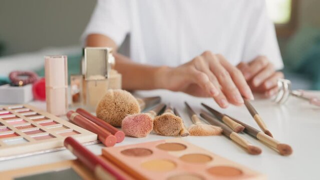 Close-up Cosmetic, Eye shadow palette, Lipstick, Foundation, Young Asian beauty girl collect makeup brush set. Lifestyle and people, Make up Natural look, Skin Care Cosmetics, Morning routine concept.