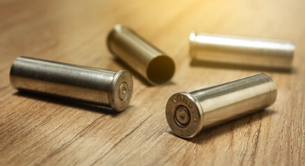 Empty fired .357 magnum bullet shells on the wooden house floor
