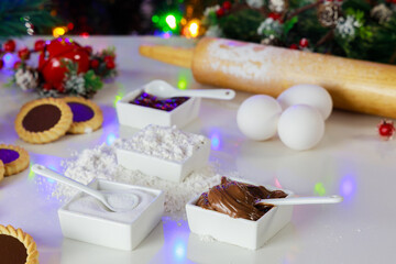 Naklejka na ściany i meble Ingredients for making Christmas cookies with jam and hazelnut spread.