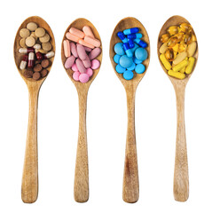 Supplement vitamin and health herbal pills in spoons