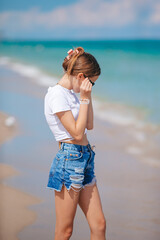 Adorable teen girl on the beach enjoy her summer vacation - 555308965