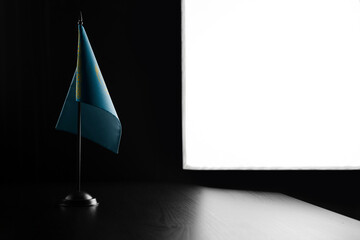 Small national flag of the Kazakhstan on a black background