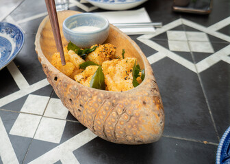Fried shrimps dish with sauce in an Asian restaurant, Auckland.