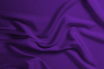 Rich and luxury red silk fabric texture background.