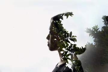 Double exposure woman on white background and outdoor nature tree plants © oqba