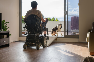 disabled man in wheelchair at home