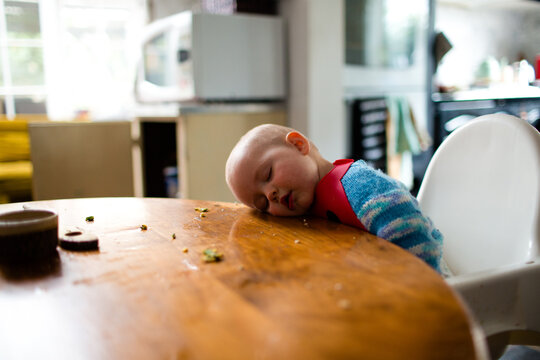 Baby asleep at the kitchen table