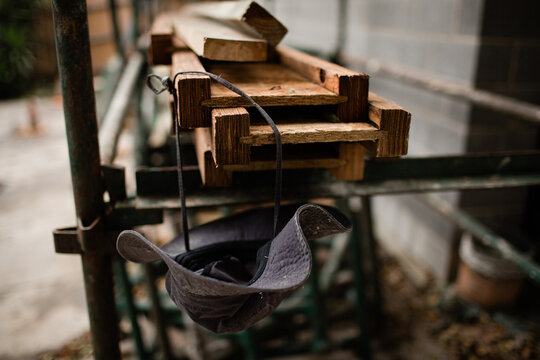 Builders hat hanging from some timber