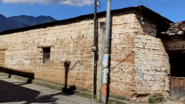 Panning shot of adobe home in rural area of Guatemala. Town in Lake Atil&aacute;n